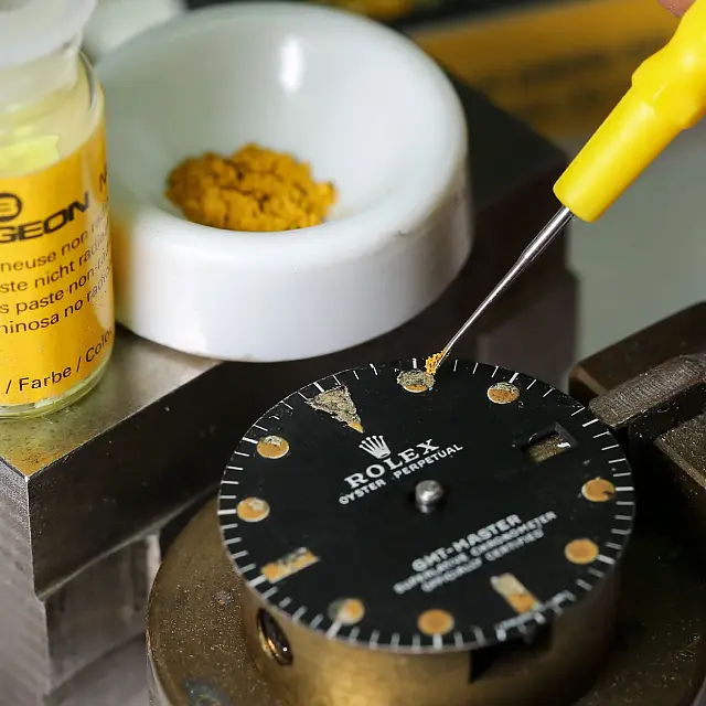 Vintage watch dial being restored